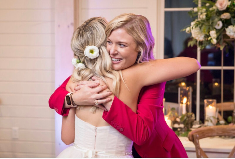 Georgia wedding planner hugs bride